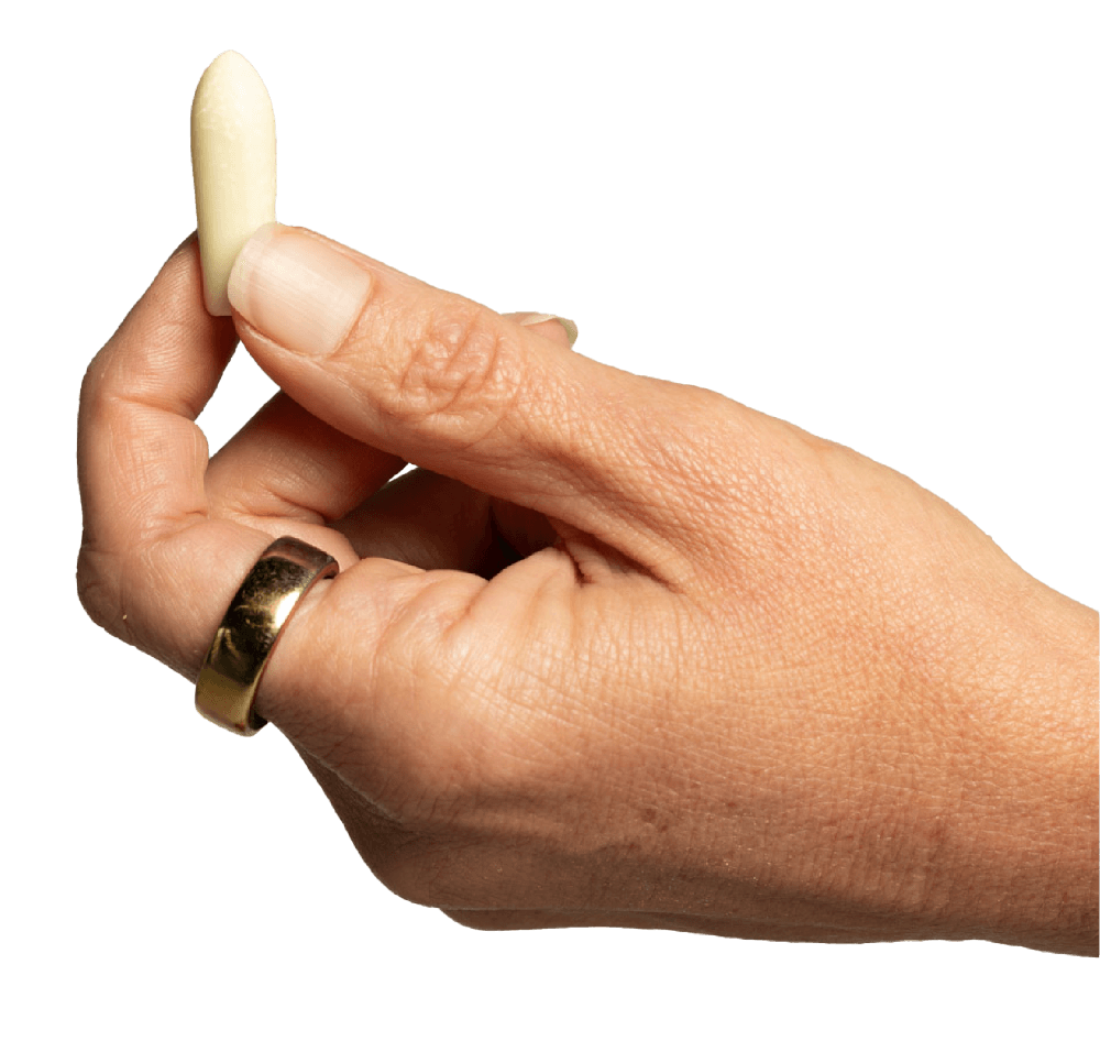Hand holding a suppository