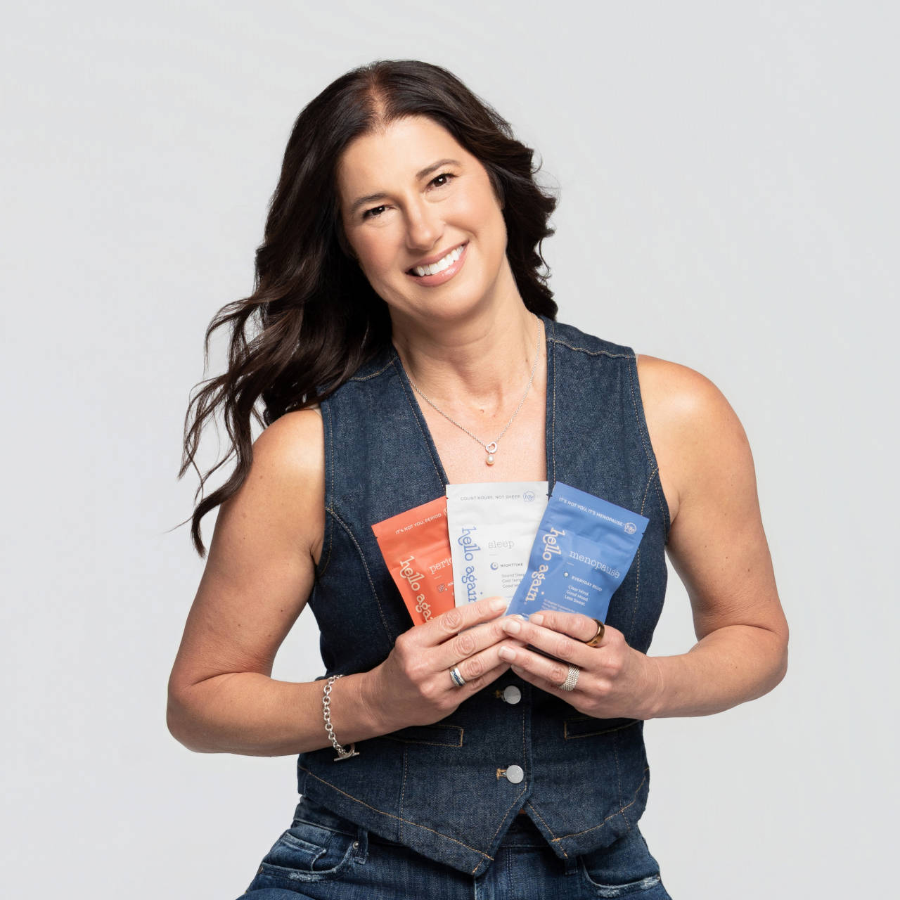 Lisa Williams, CEO, holding all three Hello Again Products